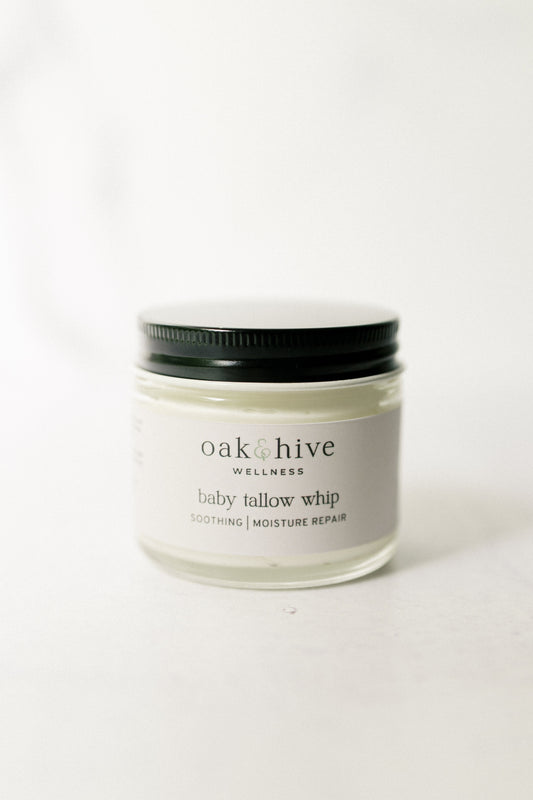 Jar of 'oak & hive wellness' baby tallow whip on a white background