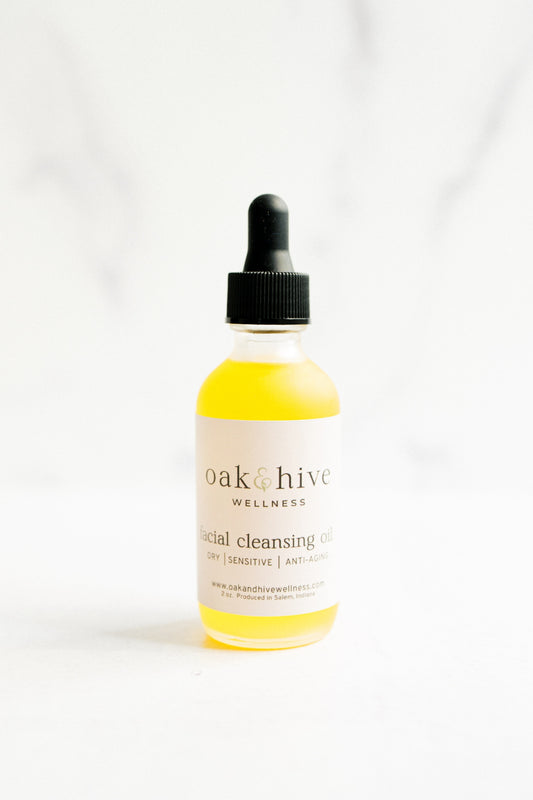 Bottle of facial cleansing oil from Oak & Hive Wellness on a white background
