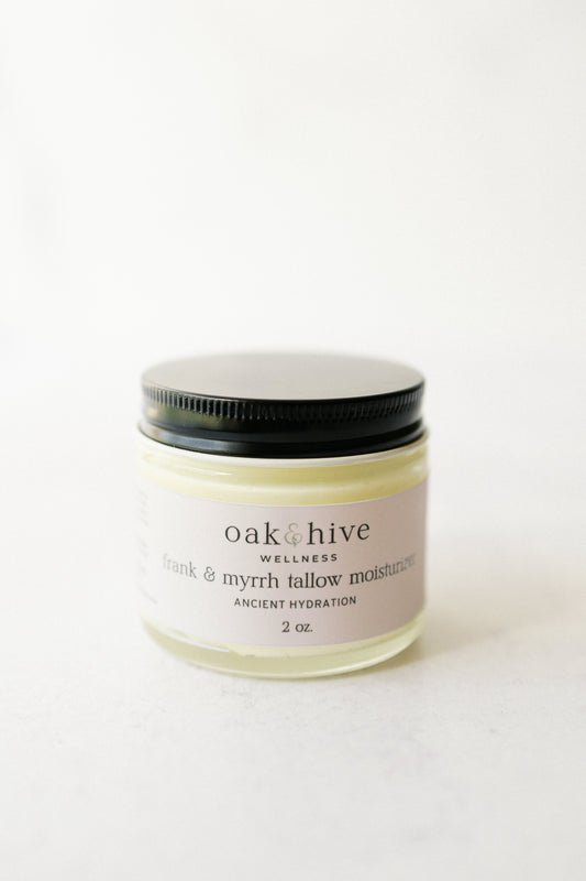 A jar of Oak & Hive Tallow Moisturizer with a label that includes the product name and the brand's logo.