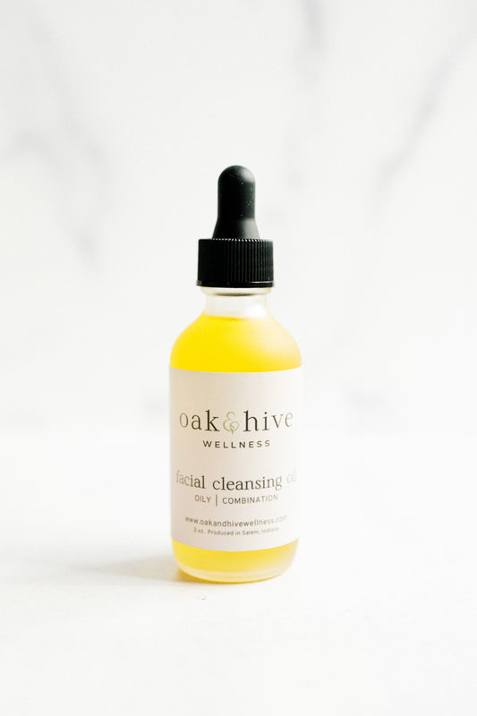Bottle of 'oak & hive Wellness' facial cleansing oil on a white background