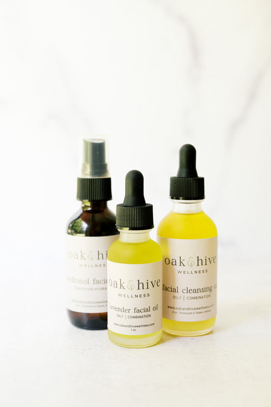 Three bottles of Oak + Hive Wellness products on a white background for oily and combination skin types.