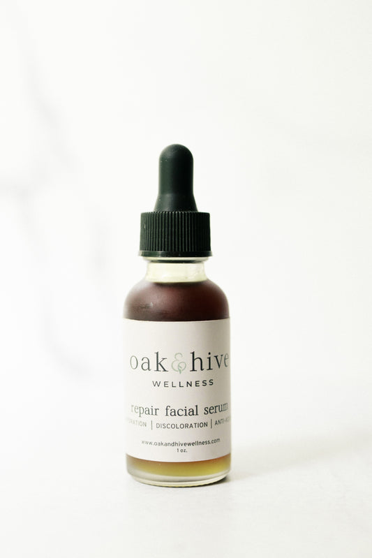 Bottle of oak & hive wellness repair facial serum on a white background