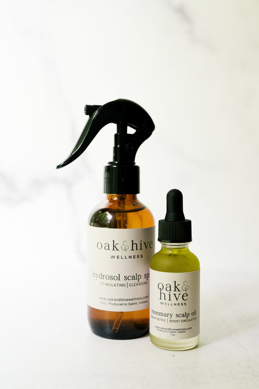 Two bottles of 'oak & hive' scalp care products on a white background