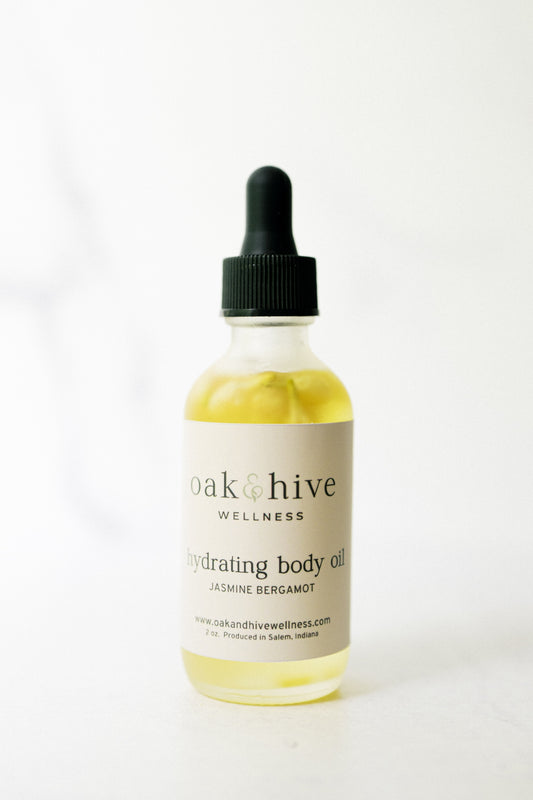 Bottle of oak & hive wellness jasmine bergamot body oil on a white background