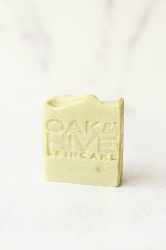 a green bar of soap on a white background 